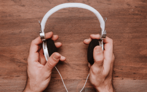 Holding headphones